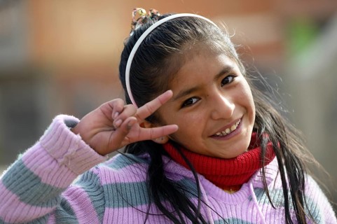 Girl making the victory sign