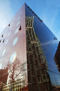 Dancing Towers office building reflected in the facade of the Arcotel Onyx Hotel