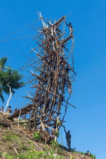 Man jumping from a bamboo tower