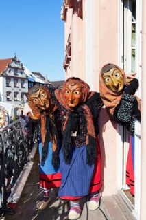Three witches on the balcony of Gengenbach Town Hall