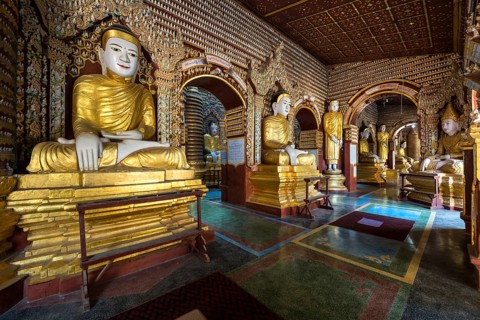 Seated and standing Buddha statues
