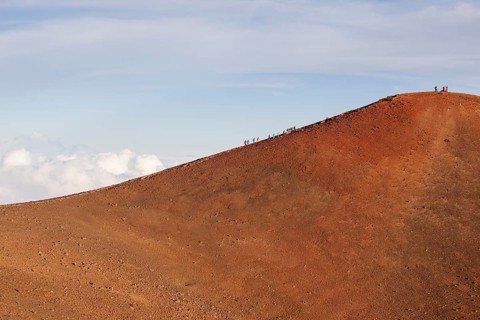 Hikers on the summit of the Mauna Kea volcano