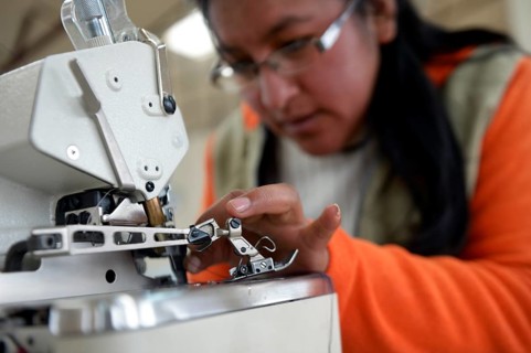Seamstress working on a sewing machine