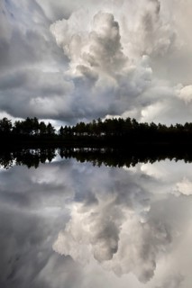Naveretjarn Lake with dramatic clouds and mirroring