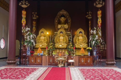 Buddha statues with an altar in Linh Thuu Pagoda