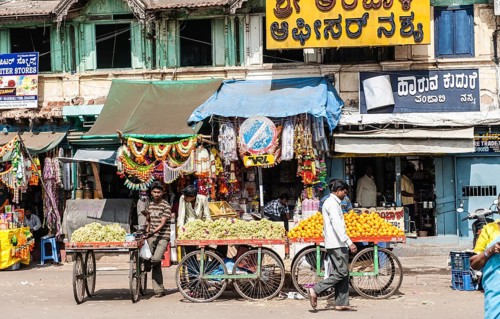 Stall with bananas and oranges