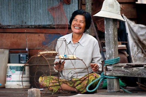 Native woman with a fish trap