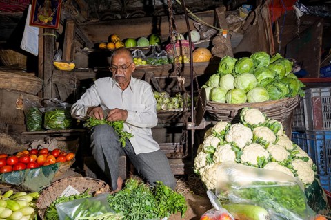 Man selling vegetables at Crawfort Market
