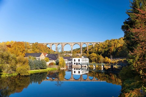 Gohren railway viaduct with reflections in the Zwickauer Mulde river