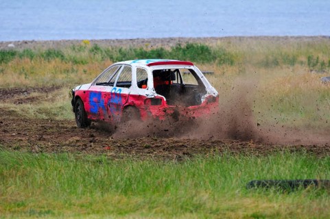 Stock car race on a meadow at the beach near Golspie