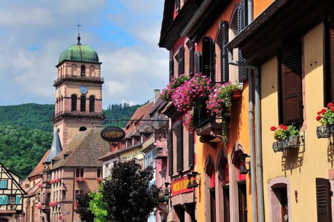 Houses on Rue du General de Gaulle in front of the Church of Sainte-Croix