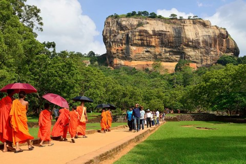 Buddhist monks on their way to the Lion Rock