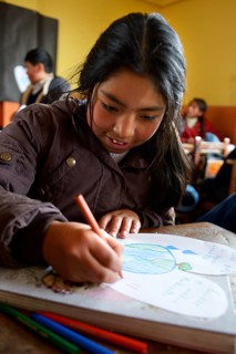 Pupil painting a picture about environmental protection