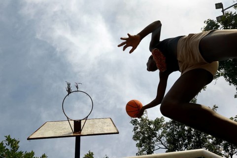 Youth making a layup in basketball