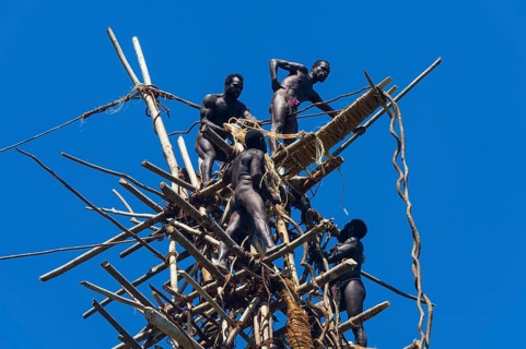 Men preparing the bamboo tower