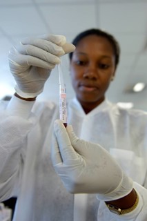 A lab technician is analysing blood samples in a laboratory
