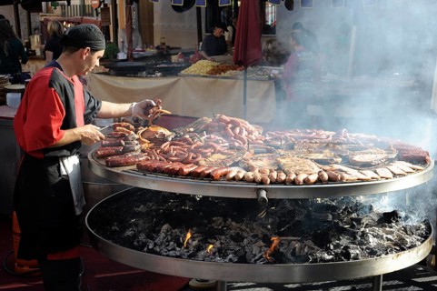 Cook handles giant barbecue at the annual All Saints Market in Cocentaina