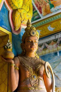 Statue in the old Buddhist temple complex of Sri Pushparama Maha Viharaya