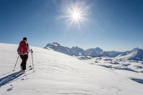 Ski tourer climbing Seekofel mountain