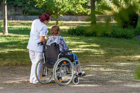 Woman sitting in wheelchair