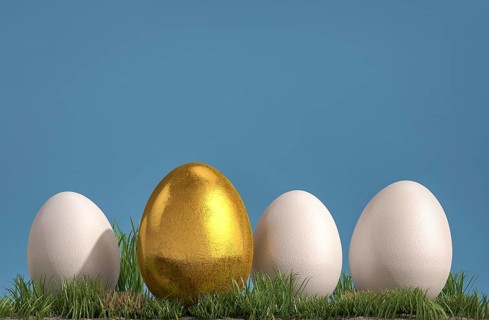 Three white and one golden egg