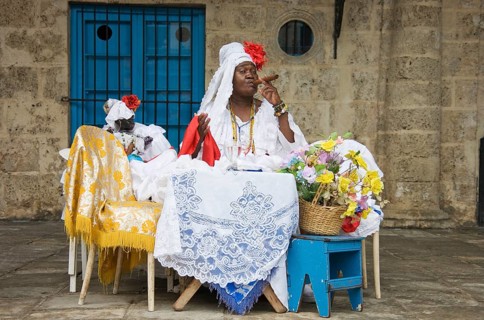 Fortune teller posing with a cigar