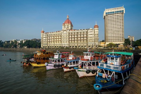 Ferryboats anchoring in the harbour in front of Taj Mahal Palace Hotel