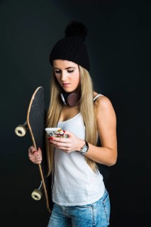 Cool young woman with a skateboard