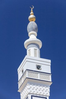 Minaret with a golden crescent moon