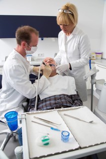 Senior man receiving treatment at the dentist