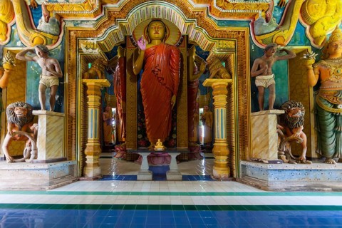 Statue in the old Buddhist temple complex of Sri Pushparama Maha Viharaya