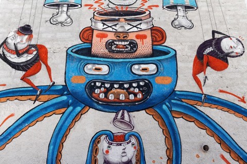 Surreal mural with heads nested into each other