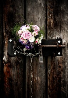 Bridal bouquet in an old door lock