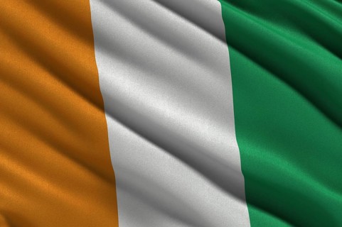Flag of the Ivory Coast or Republic of Cote d'Ivoire waving in the wind