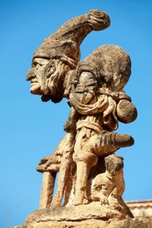 Baroque statue on the wall of Villa Palagonia