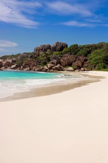 Sandy beach with the rock formations typical for the Seychelles