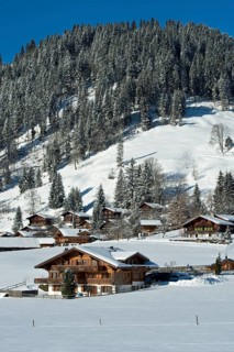 Swiss chalets in a winter landscape in Saanenland