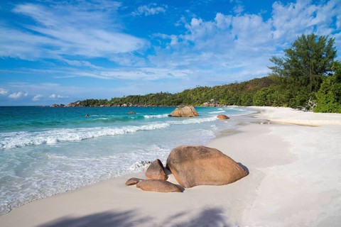 Sandy beach with the typical rock formations of the Seychelles