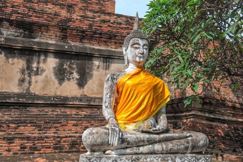 Buddha statue next to the central stupa