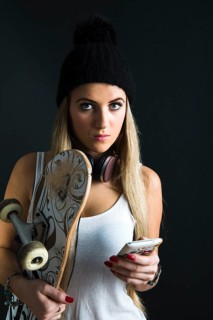 Cool young woman with a skateboard