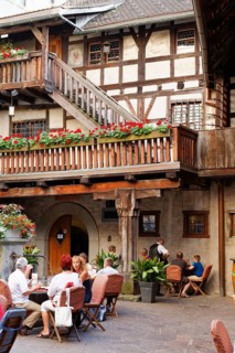 Courtyard of Schattenburg Castle with a restaurant