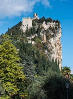 Mighty cliff with the ruins of Arco Castle or Castello di Arco above Arco