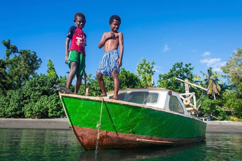 Local boys on a motorboat