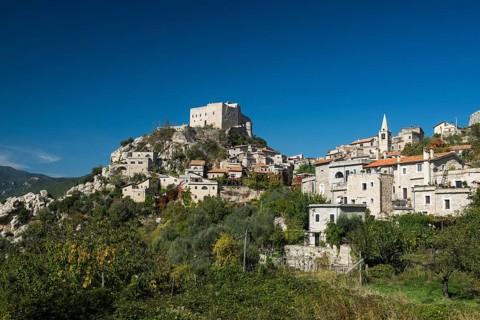Medieval village with a castle in the mountains