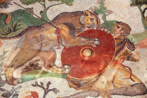 Ancient Roman mosaic of a hunter and a lion