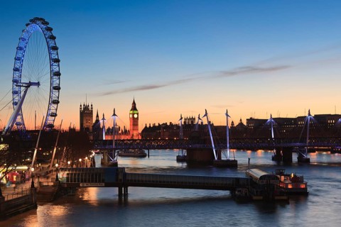 View of the River Thames with the London Eye and the Houses of Parliament at dusk