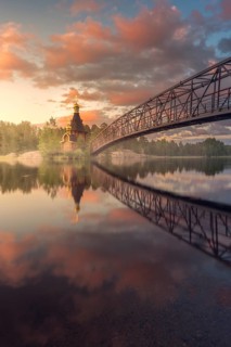 Bridge and Church of St. Andrew at Vuoksi River during sunset
