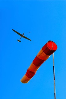 Glider at winch launching and wind sock as indicator for direction and strength of the wind