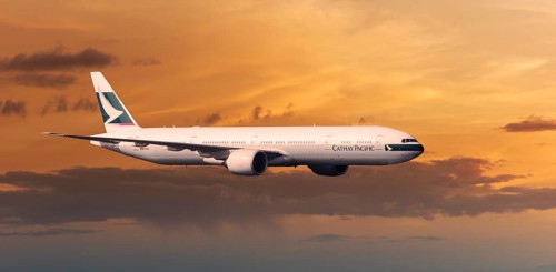 Cathay Pacific Boeing 777-367 ER in flight in the evening light