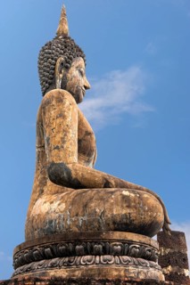 Buddha statue at the ruins of Wat Phra Si Rattana Mahathat temple complex